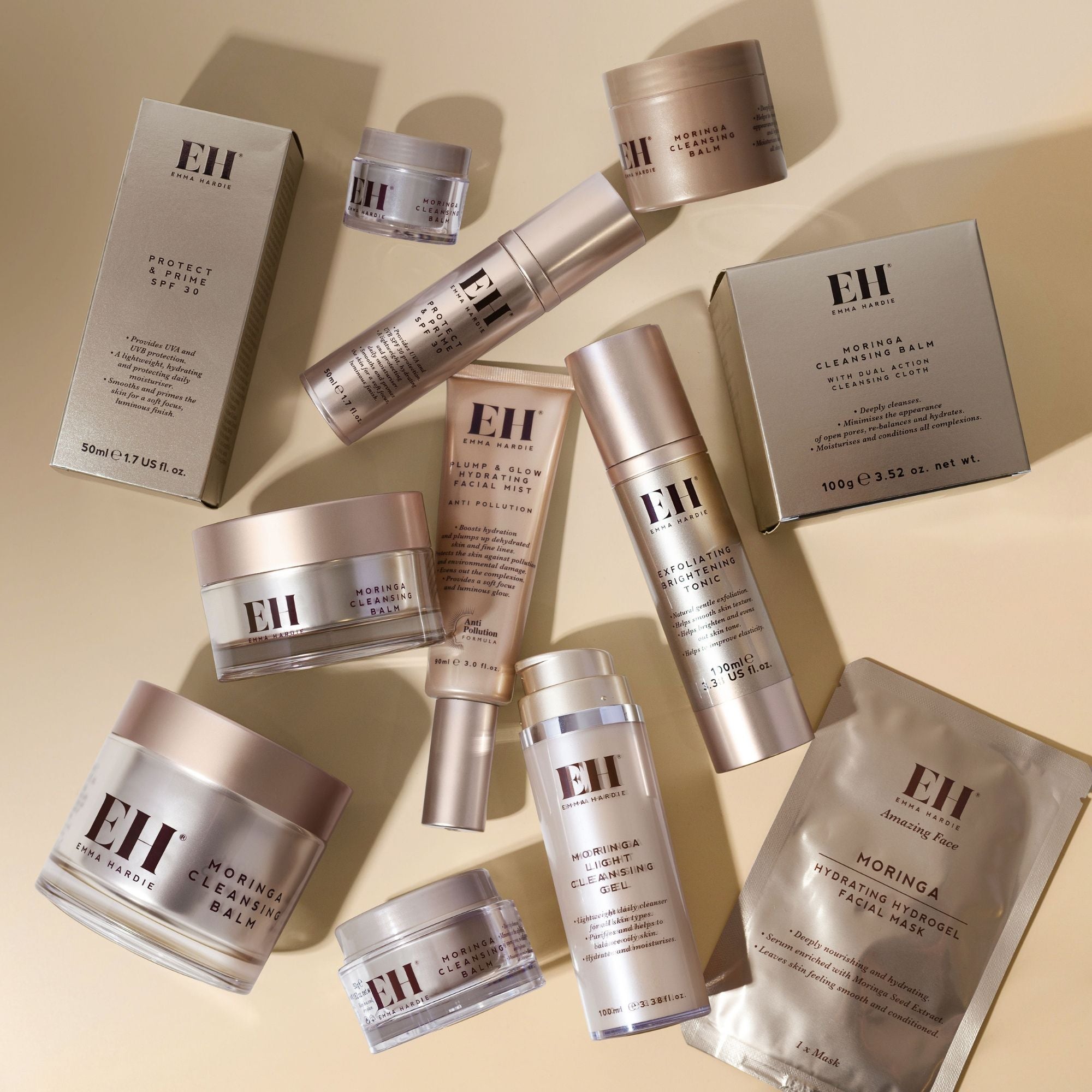 Full range of Emma Hardie Amazing face products on a beige background