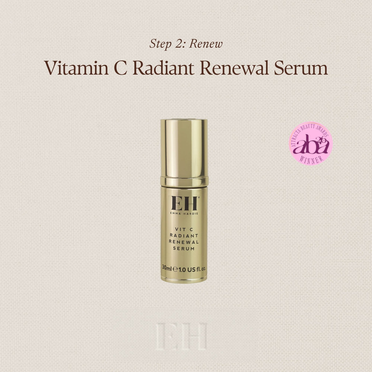 A gold Emma Hardie Vitamin C Radiant Renewal Serum bottled centered on a light beige textured background, with text reading 'Step 2: Renew' and 'Vitamin C Radiant Renewal Serum' above it. A pink circular logo appears to the right.
