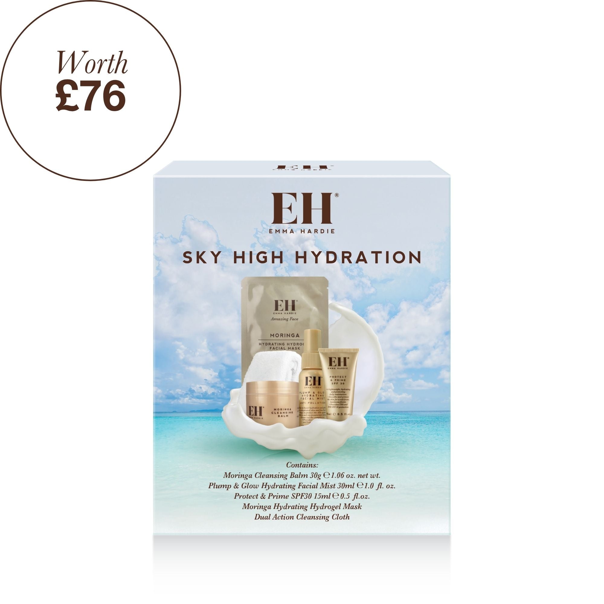 Emma Hardie Sky High Hydration skincare set in its retail box, featuring a light blue tropical beach background on the packaging with visible gold and white skincare items inside.