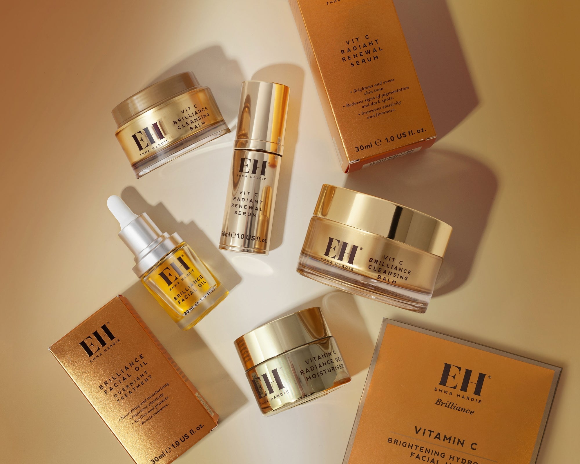 Emma Hardie Brilliance range featuring the Vit C Cleansing Balm, Radiant Renewal Serum, Brilliance Facial Oil, Radiance Gel Moisturiser and Brightening Hydrogel Facial Mask.