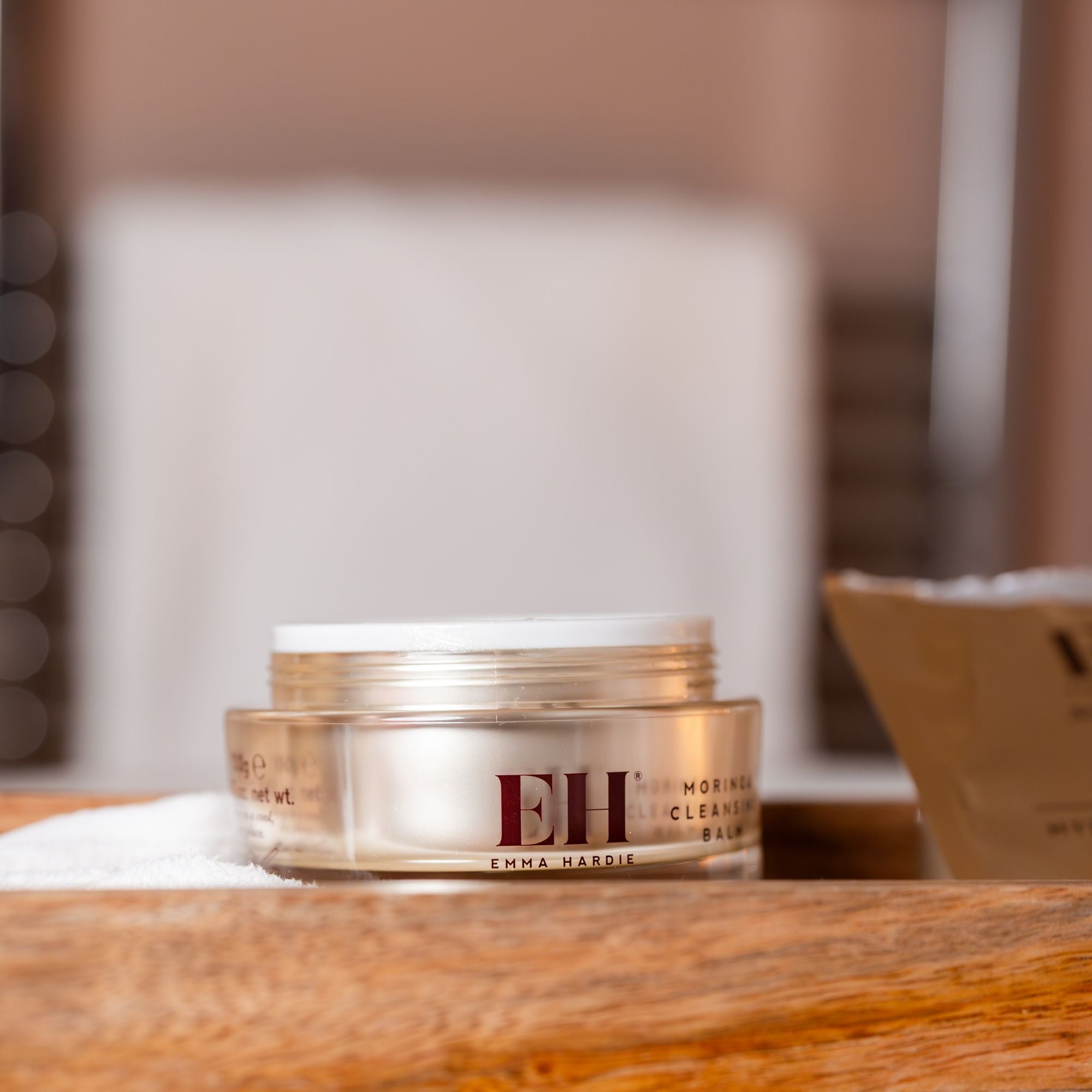 Jar of Emma Hardie Cleansing Balm on a bathroom tray