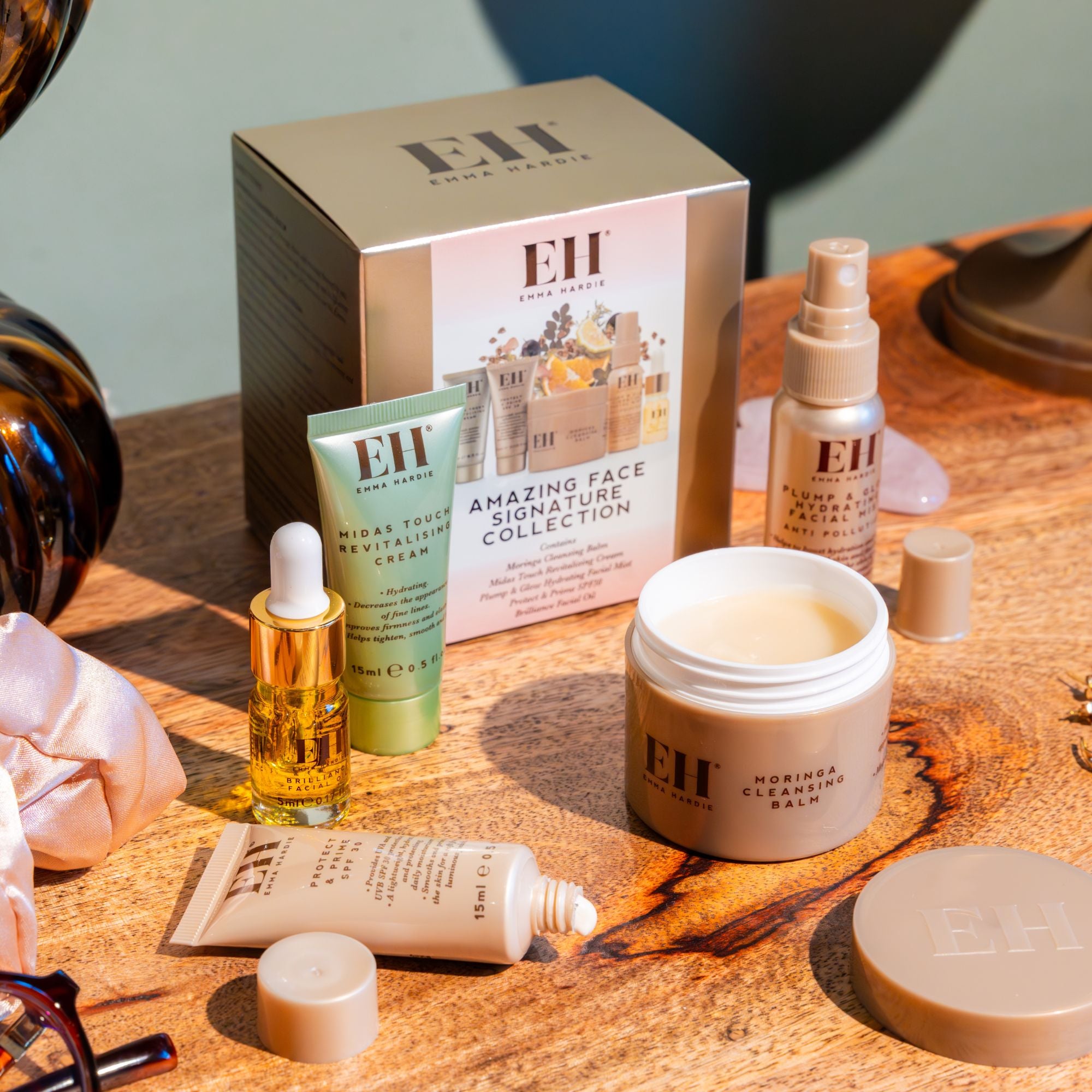 Amazing Face Signature Collection travel-size skincare set showing Moringa Cleansing Balm, Protect & Prime SPF30, Plump & Glow Hydrating Mist, Midas Touch Revitalising Cream and Brilliance Facial Oil.