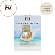 Emma Hardie Sky High Hydration skincare set in its retail box, featuring a light blue tropical beach background on the packaging with visible gold and white skincare items inside.
