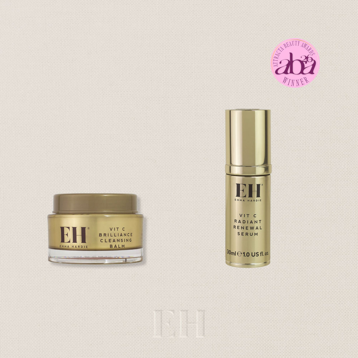 Emma Hardie ritual set featuring a Vit C Briliance Cleansing Balm jar and a Vit C Radiant Renewal Serum bottle, both in gold packaging, shown on a white background with a 'Worth £94' badge and a pink Attracta Beauty 2026 Winner Sticker