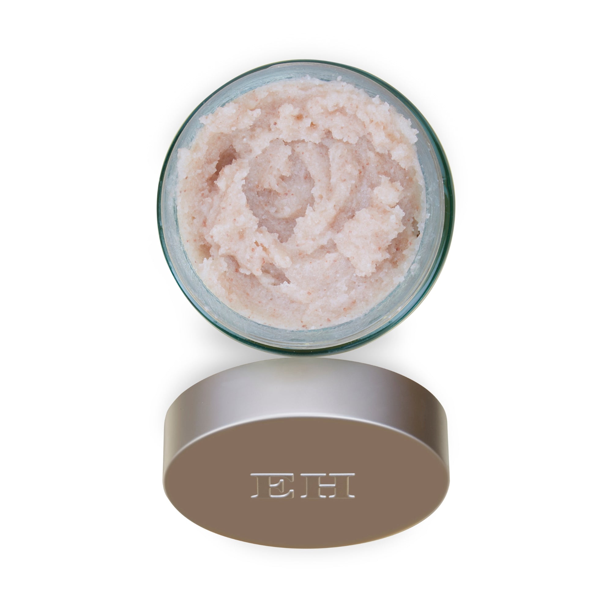Jar of beige cream with a beige lid on a white background